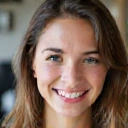 Client testimonial photo of a smiling young woman